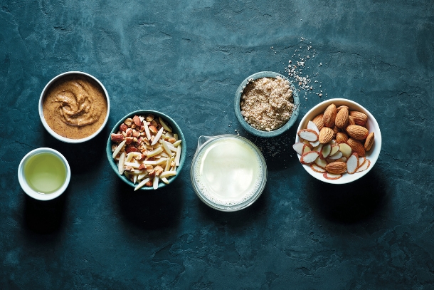 Almond-based ingredients on a dark surface